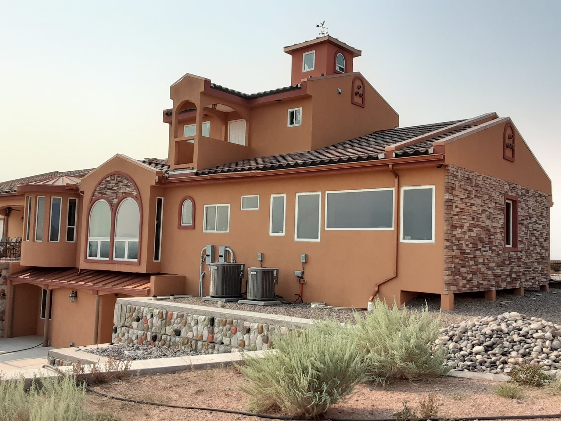 Finished tile roof on a stucco New Mexico home by Paramount Roofing
