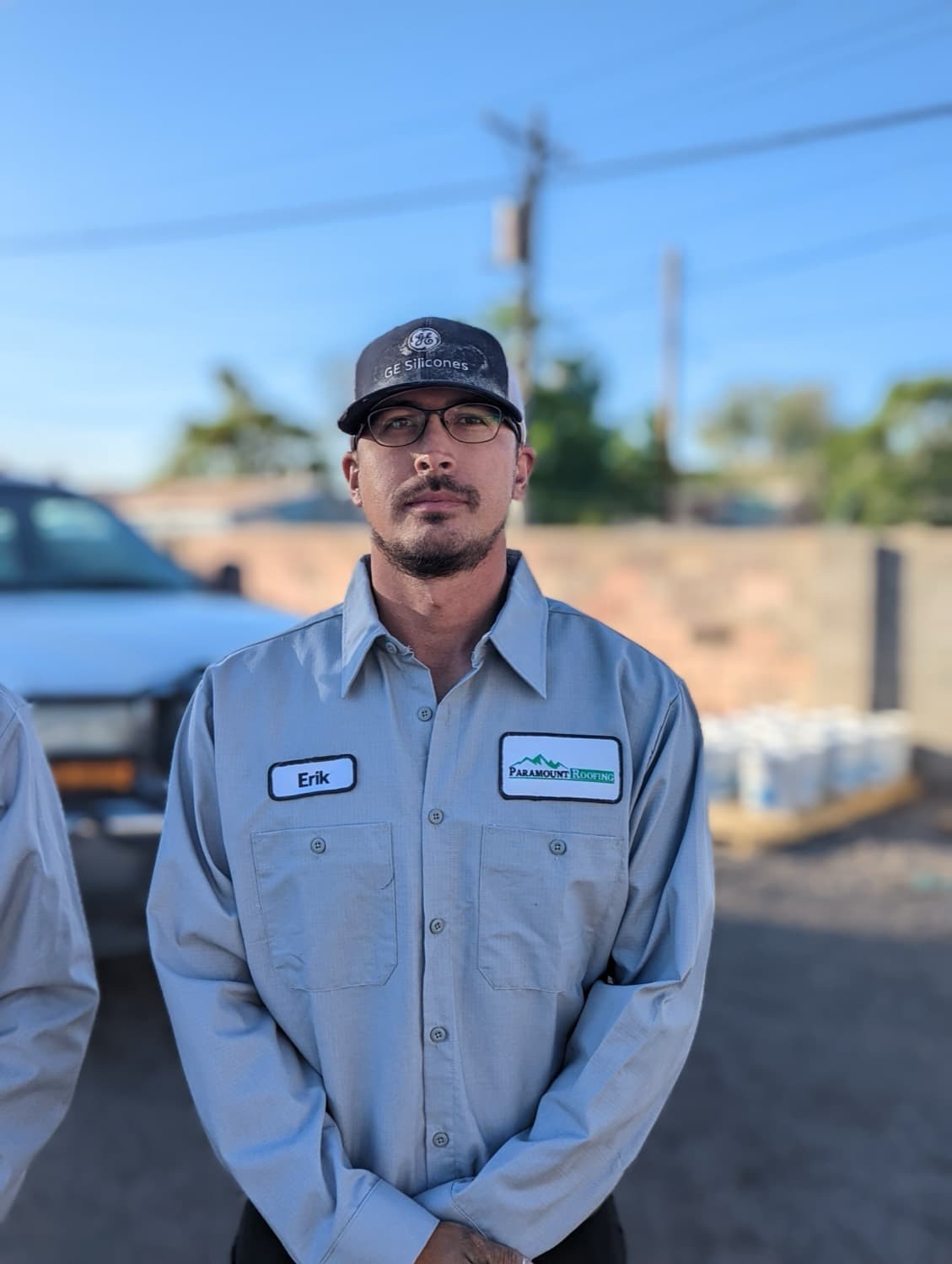 A Paramount Roofing crew member